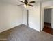 Bedroom showcasing neutral carpet, ceiling fan, and ample closet space at 1048 E 6Th Ave, Mesa, AZ 85204