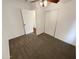 Bedroom features ceiling fan, carpeted floors, and a closet with sliding doors at 1048 E 6Th Ave, Mesa, AZ 85204