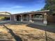 Inviting single-story home featuring a covered front porch and a spacious front yard at 1048 E 6Th Ave, Mesa, AZ 85204