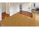 Open kitchen with a large island, hardwood floors, and views into the dining and living area at 1048 E 6Th Ave, Mesa, AZ 85204