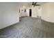 Spacious carpeted living room features a ceiling fan and multiple windows at 1048 E 6Th Ave, Mesa, AZ 85204