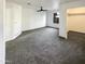 Main bedroom features neutral carpet, ceiling fan, closet, and a window at 1048 E 6Th Ave, Mesa, AZ 85204