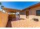 Charming back patio with tiled flooring, a covered pergola, and a comfortable bench at 1066 Leisure World --, Mesa, AZ 85206