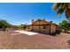 Expansive backyard with a covered patio and low-maintenance desert landscaping at 1066 Leisure World --, Mesa, AZ 85206