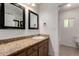 Bathroom featuring granite counters, two mirrors, and modern fixtures at 1066 Leisure World --, Mesa, AZ 85206