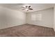 Spacious carpeted bedroom with a ceiling fan and ample natural light at 1066 Leisure World --, Mesa, AZ 85206