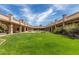 Lush courtyard featuring a well-manicured lawn and a central water fountain feature at 1066 Leisure World --, Mesa, AZ 85206