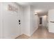 Bright entryway features tile flooring, a decorative glass front door, and a hallway leading to other rooms at 1066 Leisure World --, Mesa, AZ 85206
