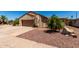 Inviting single-story home with desert landscaping, a two-car garage, and warm curb appeal at 1066 Leisure World --, Mesa, AZ 85206