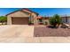Charming single-story home featuring a well-manicured front yard and a two-car garage at 1066 Leisure World --, Mesa, AZ 85206