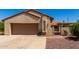 Charming home exterior with a two-car garage and well-maintained landscaping at 1066 Leisure World --, Mesa, AZ 85206