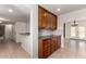 Kitchen features wood cabinets, granite counters, and tile backsplash at 1066 Leisure World --, Mesa, AZ 85206