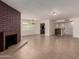 Spacious living room showcasing a cozy fireplace, and neutral tile flooring throughout the area at 1066 Leisure World --, Mesa, AZ 85206