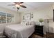 This cozy bedroom is complete with a ceiling fan and a window for natural light at 1087 Leisure World --, Mesa, AZ 85206