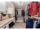 The walk-in closet includes built-in shelving and drawers for maximum storage at 1087 Leisure World --, Mesa, AZ 85206