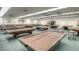 Large game room includes multiple covered billiard tables in a well lit and spacious area at 1087 Leisure World --, Mesa, AZ 85206