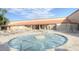 Inviting in-ground hot tub with clear bubbling water surrounded by lounge seating and a well-maintained deck at 1087 Leisure World --, Mesa, AZ 85206