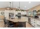 Beautiful kitchen with granite countertops, stainless appliances, a large island, and stylish pendant lighting at 1087 Leisure World --, Mesa, AZ 85206