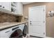 This laundry room features a washer and dryer and plenty of counter space at 1087 Leisure World --, Mesa, AZ 85206