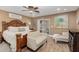 This bedroom is complete with wood-look floors and a seating area with a glass door to the backyard at 1087 Leisure World --, Mesa, AZ 85206