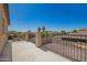 Balcony view showcasing neighborhood with mature trees and blue skies at 1120 E Jahns Dr, Casa Grande, AZ 85122