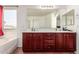 Bright bathroom featuring dual sinks, ample counter space, and modern fixtures, offering convenience and style at 1120 E Jahns Dr, Casa Grande, AZ 85122