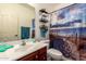 Bright bathroom with beach-themed shower curtain and stylish decor at 1120 E Jahns Dr, Casa Grande, AZ 85122