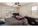 Cozy bedroom featuring a ceiling fan and large window offering natural light at 1120 E Jahns Dr, Casa Grande, AZ 85122