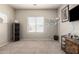 A bright bedroom with tan colored walls and carpet with a bright window at 1120 E Jahns Dr, Casa Grande, AZ 85122