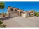 Stunning two-story home featuring a three-car garage and stone accents at 1120 E Jahns Dr, Casa Grande, AZ 85122