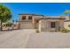 Charming two-story home featuring desert landscaping and a spacious driveway, perfect for Gathering living at 1120 E Jahns Dr, Casa Grande, AZ 85122