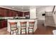 Modern kitchen with breakfast bar seating offering a casual dining spot and a view to the main living area at 1120 E Jahns Dr, Casa Grande, AZ 85122