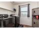 Efficient laundry room features modern washer and dryer with storage at 1120 E Jahns Dr, Casa Grande, AZ 85122