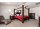 Elegant main bedroom featuring a canopy bed, plush carpet, and a peaceful ambiance, ideal for relaxation at 1120 E Jahns Dr, Casa Grande, AZ 85122
