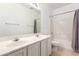 Standard bathroom featuring a double sink vanity, tiled shower and toilet at 15811 N 155Th Dr, Surprise, AZ 85374