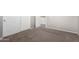 Bedroom with carpet and white trim, showcasing an open doorway at 15811 N 155Th Dr, Surprise, AZ 85374