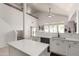 Well-equipped kitchen featuring a breakfast bar, white cabinetry, and stainless steel appliances at 15811 N 155Th Dr, Surprise, AZ 85374
