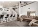 Bright and open living room with staircase features a large sectional sofa, and neutral decor at 15811 N 155Th Dr, Surprise, AZ 85374