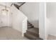 Carpeted staircase leads to the second floor of this bright and spacious home at 15811 N 155Th Dr, Surprise, AZ 85374