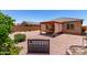 Charming backyard featuring a covered patio, gravel landscaping, and tasteful garden decor at 1662 E Kingman Pl, Casa Grande, AZ 85122