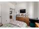 Bedroom view showcasing a dresser and a glimpse into the ensuite bathroom at 1662 E Kingman Pl, Casa Grande, AZ 85122
