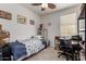 Cozy bedroom with a single bed, desk, and window providing natural light at 1662 E Kingman Pl, Casa Grande, AZ 85122