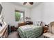 Bright bedroom with a comfy bed, wooden dresser, and a sunlit window at 1662 E Kingman Pl, Casa Grande, AZ 85122