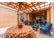 Inviting covered patio with a dining table and comfortable seating area, perfect for outdoor gatherings at 1662 E Kingman Pl, Casa Grande, AZ 85122
