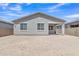 View of the backyard with covered patio on a sunny day and a stucco home exterior at 1960 N Loretta Pl, Casa Grande, AZ 85122