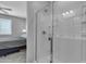 Modern bathroom featuring a glass-enclosed shower with white tile and fixtures at 1960 N Loretta Pl, Casa Grande, AZ 85122