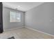 Simple bedroom with neutral paint, tiled floors, a window, and base trim at 1960 N Loretta Pl, Casa Grande, AZ 85122