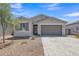 Beautiful single-story home with low maintenance desert landscaping, charming architectural details, and a spacious two-car garage at 1960 N Loretta Pl, Casa Grande, AZ 85122