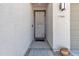 The house features a secure front door and is adorned with a modern security screen at 1960 N Loretta Pl, Casa Grande, AZ 85122
