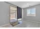 Bright living space with sliding glass doors to patio and neutral decor, featuring tiled floors and a window at 1960 N Loretta Pl, Casa Grande, AZ 85122